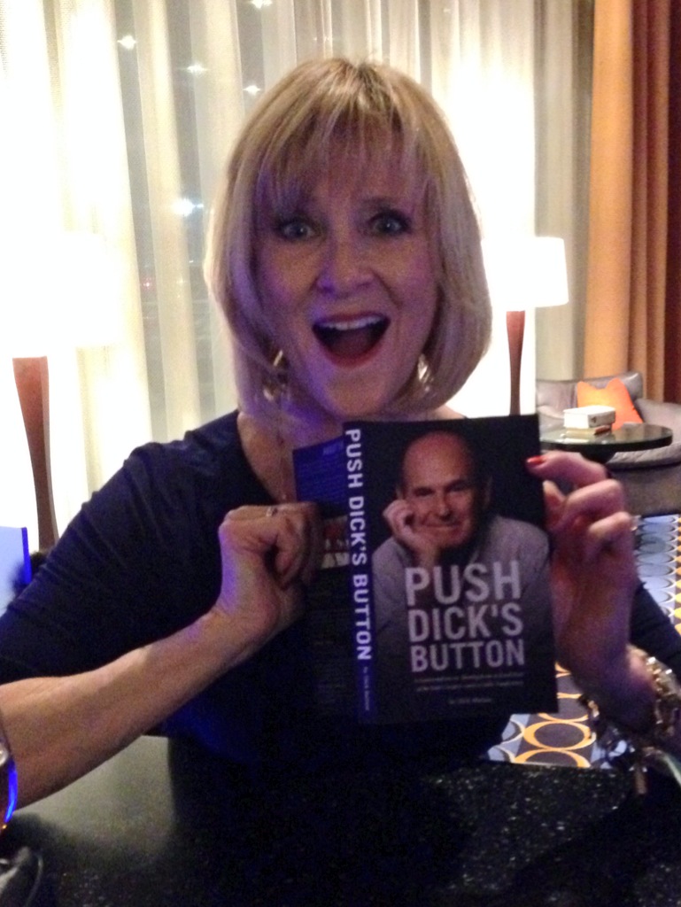 JoJo Starbuck holding up a copy of Dick Button's book in a photo for the manleywoman skatecast, a figure skating podcast